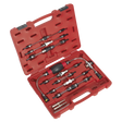 The Diesel Fuel Priming Set - VS555 by Sealey is presented in a red plastic case containing various automotive pressure test adapters, quick connectors, and the fuel priming set itself. All components are arranged neatly in custom slots for organization and protection. The open case displays the tools inside.