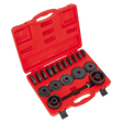 The Sealey VS7020 Wheel Bearing Removal/Installation Kit comes in a red plastic case with black cylindrical tools of various sizes, all organized neatly in fitted slots. When the case is open, it reveals all the tools and attachments needed for removing wheel bearings from front-wheel drive vehicles.