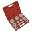 A Sealey Bearing Race & Seal Driver Set, model VS703, comes in a red plastic case with a handle and includes various popular bearing race sizes along with an assortment of circular metal dies and a central cylindrical tool, all neatly arranged in individual compartments.