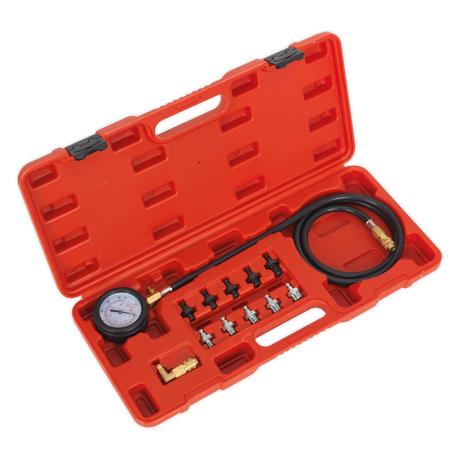 The Sealey Oil Pressure Test Kit 12pc - VSE203 comes in a red plastic carrying case containing a pressure gauge, black hose, quick coupling adaptors, and multiple connectors and fittings neatly arranged inside.