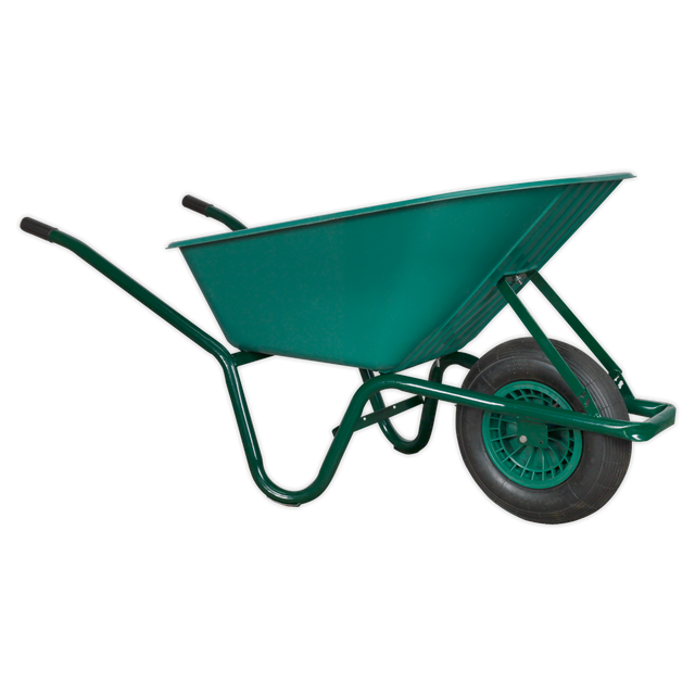 The Sealey Wheelbarrow 85L - WB85 is a green wheelbarrow with a single wheel and black handles, featuring a durable tubular steel frame for transporting materials in construction or gardening.