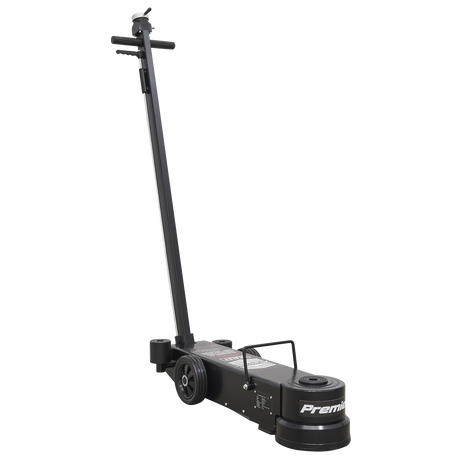 The Sealey Air Operated Jack 20-60 Tonne Telescopic - Long Reach/Low Profile (YAJ20-60LR) features a long handle, two rear wheels, and a front lifting pad, making it "Premium" quality for efficiently lifting heavy plant equipment.