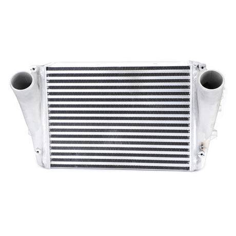 A front view of a metallic AGCO | Intercooler, Air To Air Type - Acw043584A car intercooler with two large tubular inlets on either side, designed to enhance engine efficiency by optimizing compressed air temperature.