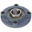 AGCO | Bearing Assembly - Acw1830600, a round, blue metallic bearing housing featuring a central cylindrical opening and four bolt holes, designed for precision alignment.