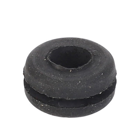 Close-up of the AGCO Grommet - 3477717M1, a black rubber grommet with a central hole and a split groove around its circumference, ideal for use in Valtra models.