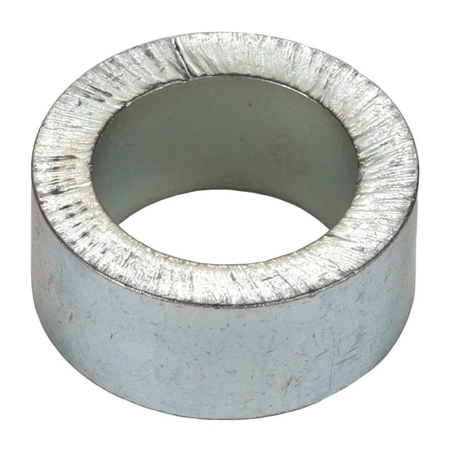 The AGCO | Bush - Acp0015590, by AGCO, is displayed against a pristine white background, featuring a sleek silver metallic cylindrical design with a textured outer surface and a smooth inner surface.