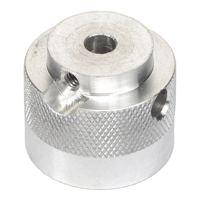 The AGCO | COUPLER - AG716993 is a cylindrical silver metal component with a knurled texture, featuring a central hole and two side holes for secure fastening.