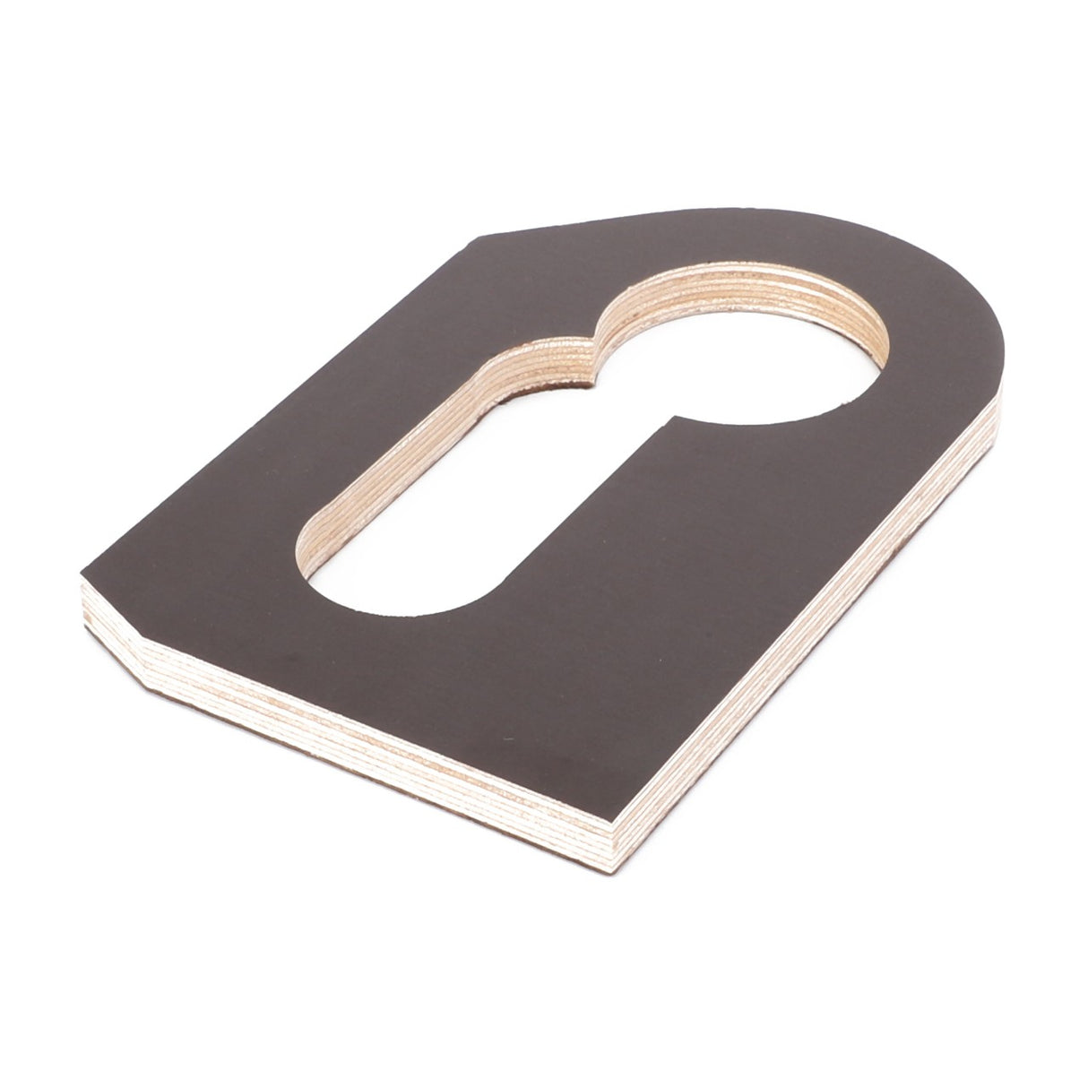 A piece of wood with a keyhole-shaped cutout, reminiscent of design details seen in AGCO's Spacer - D28251420, lies on a white surface.