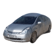 A silver car wrapped in the Sealey Temporary Universal Car Cover Large (TDCCL) with a license plate reading "SEALEY 1"—ideal for bodyshops, this disposable full car cover protects the vehicle from scratches.