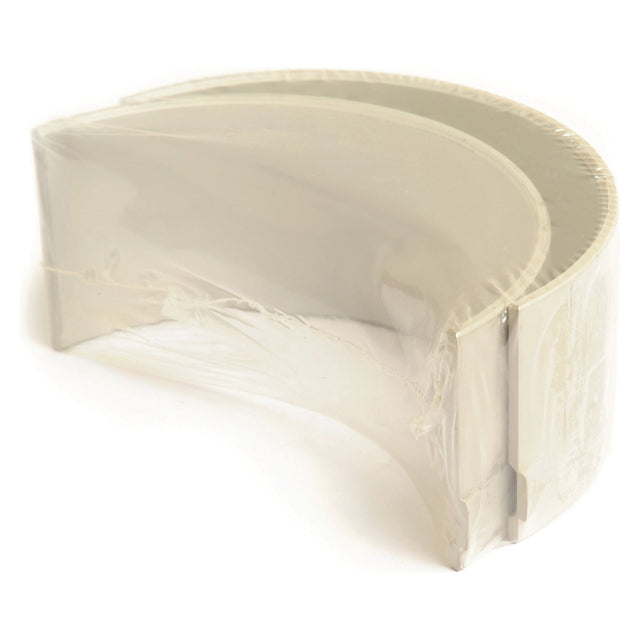 A Conrod Bearing +0.010'' (0.25mm) pair, partially wrapped in protective plastic, perfect for use with Sparex parts or enhancing your Case IH equipment.