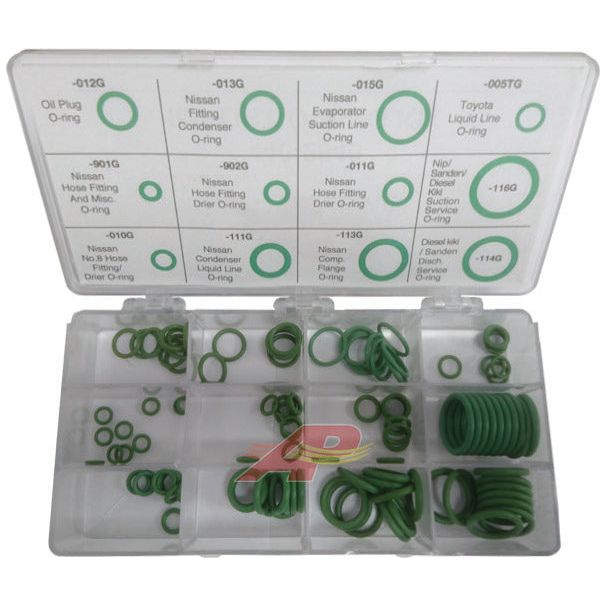 The O Ring Kit (Sparex Part No.S.153099) from Sparex is shown with its Compak container open, revealing multiple green O-rings in various common sizes neatly organized into compartments. Each compartment is labeled for specific automotive applications, including Nissan and Toyota.