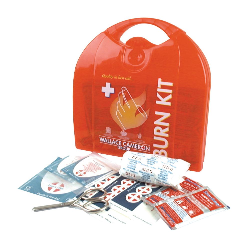 A First Aid Kit, branded as Sparex (Part No.S.18816), containing bandages, scissors, non-adherent dressings, burn gel packets, and other first aid supplies is neatly placed in front of a red plastic carrying case labeled "Burn Kit.