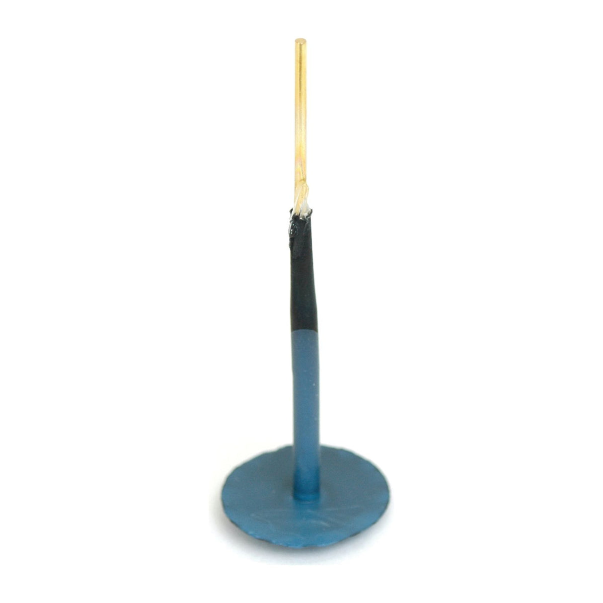 A single upright blue candle with a blackened wick, reminiscent of the precision of a Tyre Repair Refill Minicomb B8 from Sparex, set on a flat circular base.
