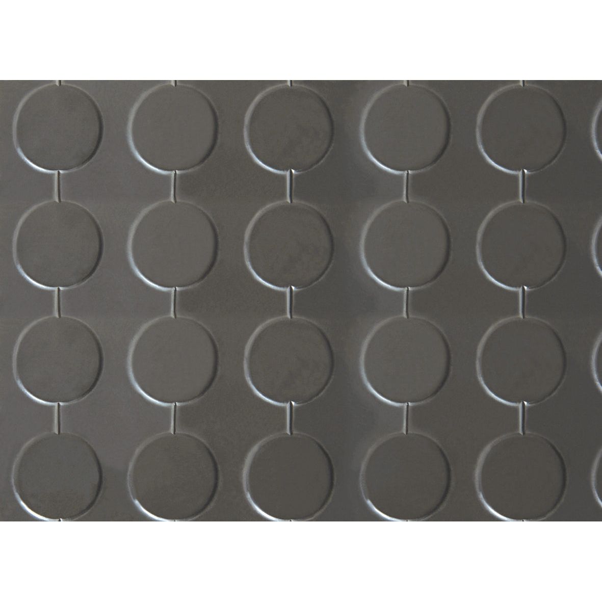 Close-up of the dark gray, circular-patterned rubber flooring with evenly spaced raised circles from durable Rubber NK/SBR, featured in the Mat 1m x 1.2m - S.35473 by Sparex.