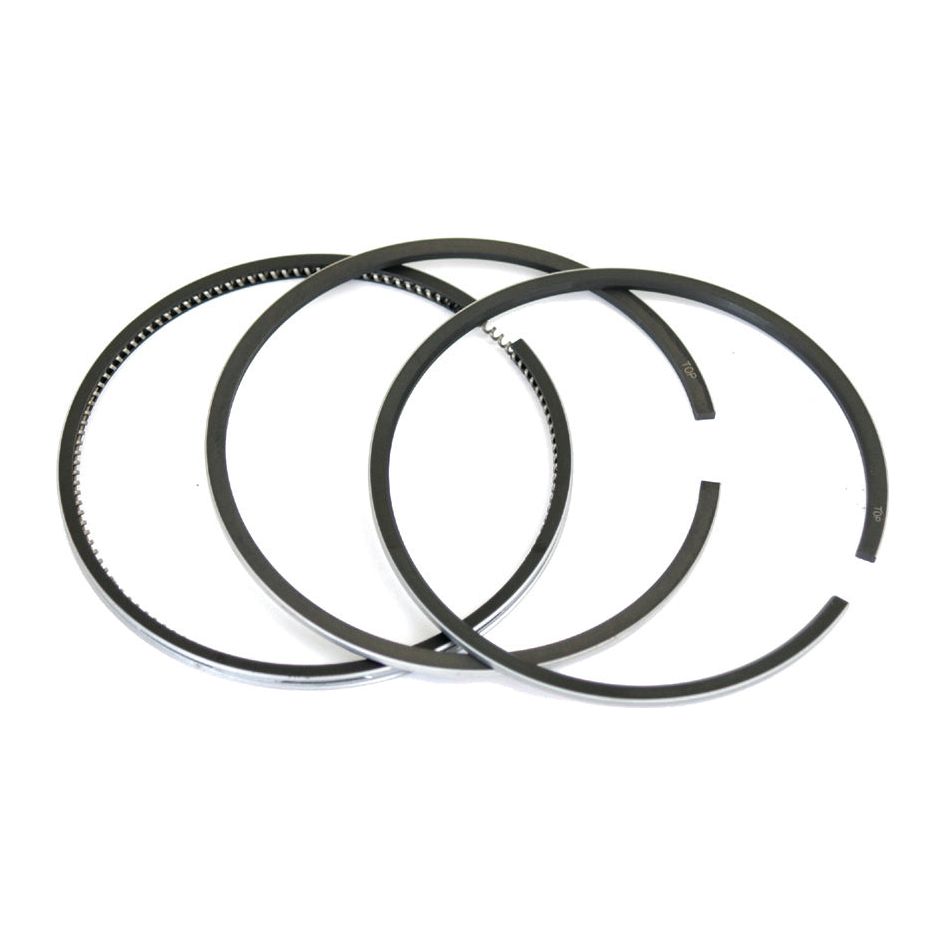 Three black piston rings from the ring set labeled under tariff code 8409990090, identified as Sparex Part No. S.4942207, are arranged in a partially overlapping pattern on a white background.