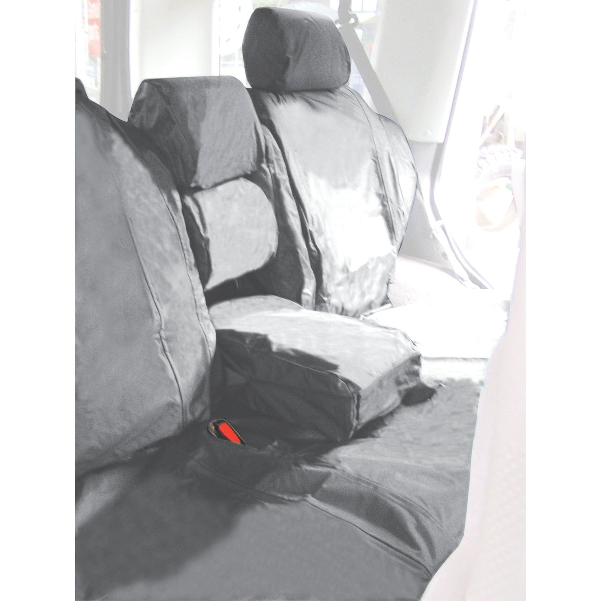 A vehicle's backseat, adorned with black waterproof seat covers from the Sparex Discovery Series II TD5 1998>2004 Rear Seat Set (Part No.S.71783), features a folded armrest at the center.