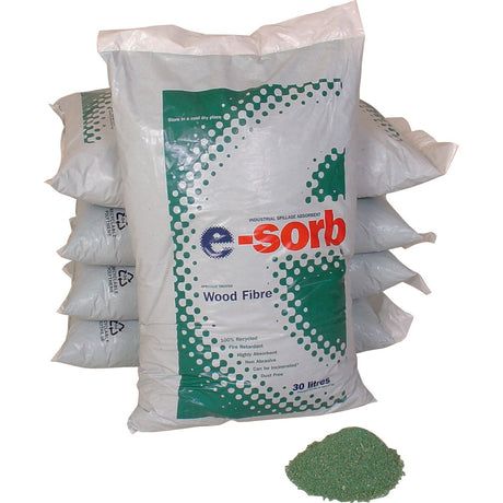 A stack of bags labeled "Absorbent Powder - S.20466" by Sparex, featuring one bag in front and a small pile of green, non-toxic granular material on the ground. The bags indicate 30 liters and 100% recycled content. This cost-effective solution is ideal for managing fluid spills efficiently.