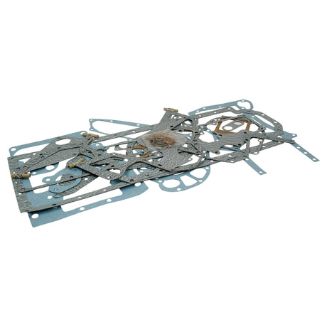 A collection of assorted gaskets in various shapes and sizes, including the Sparex Bottom Gasket Set for 6 Cylinder engines (D310, D358, DT358, DT402) compatible with International Harvester equipment, laid out on a flat surface.