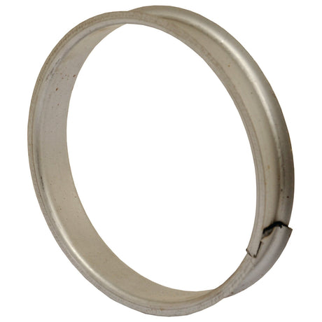 The Sparex Brush Spacer (Part No. S.79517) is a silver metal ring with a small notch or dent on one side and an approximate diameter of Ø162mm (6 3/8''). The ring appears slightly tarnished, suggesting potential previous use as a brush spacer.