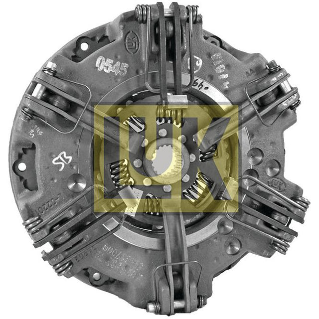 The Clutch Cover Assembly - S.145413 by Sparex is a round mechanical component featuring multiple springs and levers, encased in a cast iron housing. It includes a cerametallic captive disc and displays a yellow "UK" emblem prominently in the center.