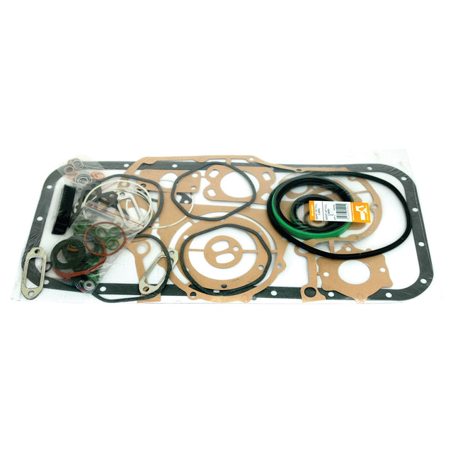 A variety of gaskets and seals laid out on a white surface, including circular, rectangular, and irregularly shaped pieces from the Sparex Complete Gasket Set - 4 Cyl. (F4L913) | Sparex Part No.S.69991.