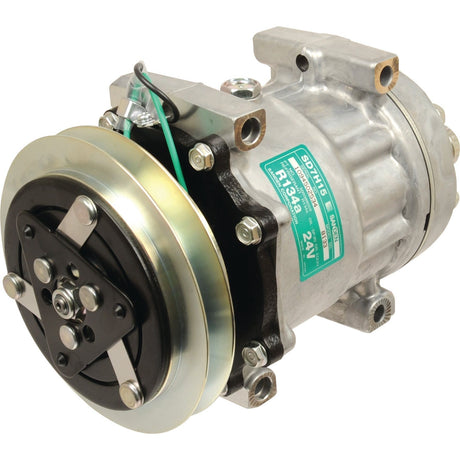 A metallic automotive air conditioning compressor, the Sparex Compressor (SD7H15) - S.112553, suitable for various vehicles, features a visible green label indicating product specifications and attached wiring.