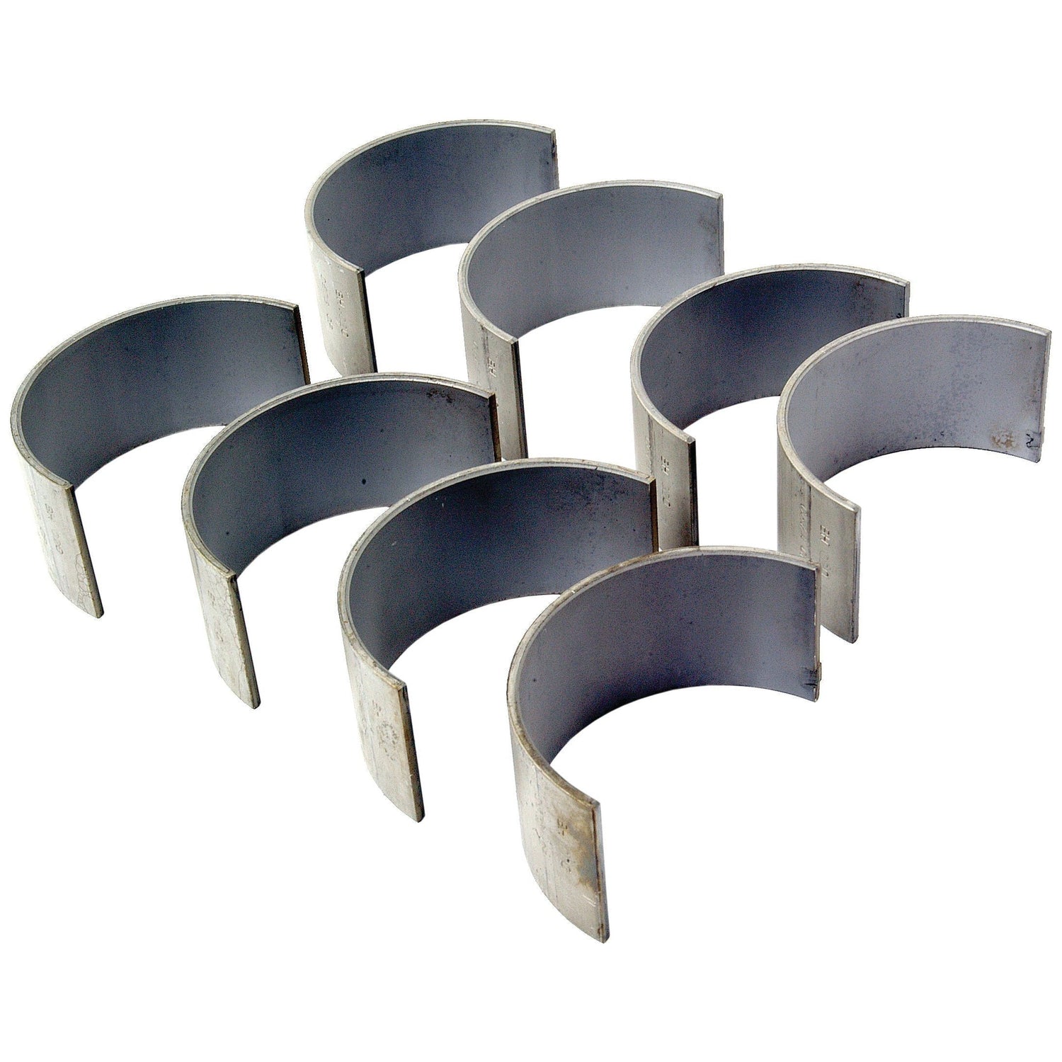 A set of eight gray metal semi-circular Conrod Bearing +0.020'' (0.50mm) shells from Sparex, perfect for Case IH and International Harvester machinery, arranged in two rows. Product No.S.42974