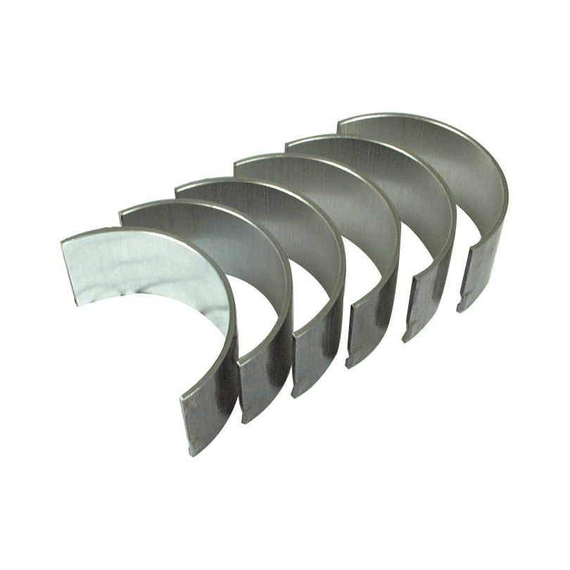Image of five semi-circular steel bearings aligned in a row, commonly used in automotive or machinery applications like those from David Brown tractors. These specific bearings are part of the Conrod Bearing +0.020'' (0.50mm) Set | Sparex Part No. S.57519 by the brand Sparex.