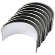 A set of seven curved metal pieces aligned in a row, resembling engine bearings, available under the name "Conrod Bearing +0.030'' (0.75mm) Set" with Sparex Part No.S.40326 from the brand Sparex. For detailed product specifications and related products, please check the catalog.