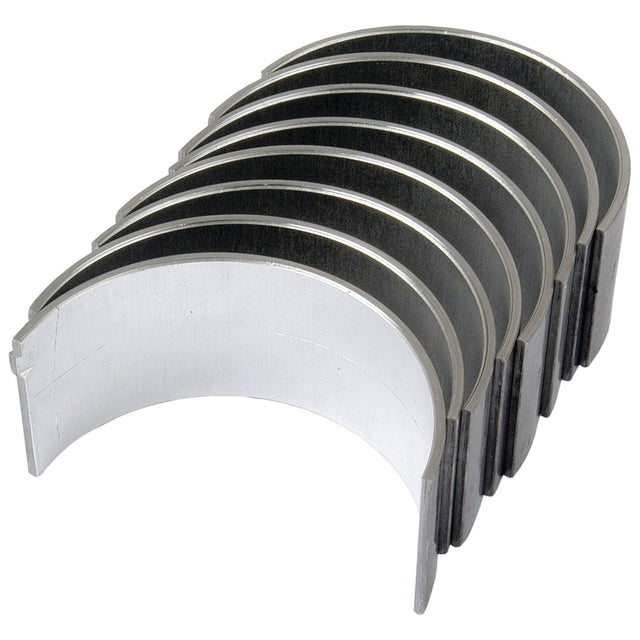 A set of seven curved metal pieces aligned in a row, resembling engine bearings, available under the name "Conrod Bearing +0.030'' (0.75mm) Set" with Sparex Part No.S.40326 from the brand Sparex. For detailed product specifications and related products, please check the catalog.