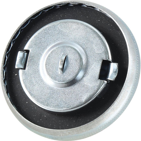 A close-up of a round, metallic knob from a gas stove, featuring a central depression and two notches on either side, strikingly resembles the Sparex Fuel Cap - Sparex Part No. S.144891.