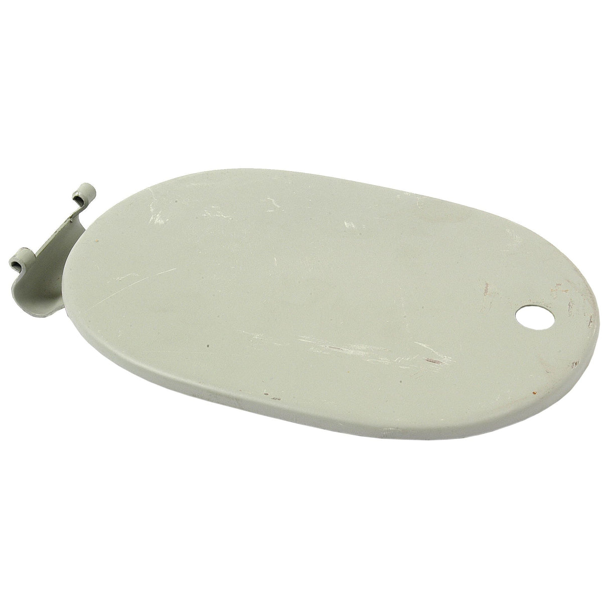 The Fuel Tank Cover Panel by Sparex (Part No. S.43142) is an oval-shaped, light grey metal plate that resembles a fuel cover, featuring a small hinge attachment on one end and a hole near the other—ideal for Case IH or David Brown machinery.