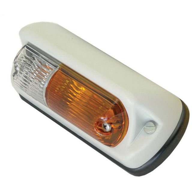 The Sparex Front Combination Light (Halogen), 6/12V, LH, Straight - S.31903 is a dual-function RV light with a rectangular shape. It features a white lens on the left and an amber lens on the right, mounted in a sleek white casing. This Hella indicator light combines functionality with style for your vehicle.