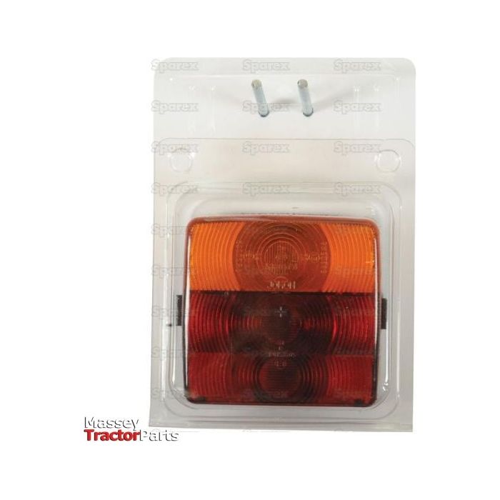 Package containing a Sparex spare part, specifically a rectangular Halogen Rear Light 12/24V - S.26240, with an orange and red polycarbonate lens material, labeled "Massey Tractor Parts".