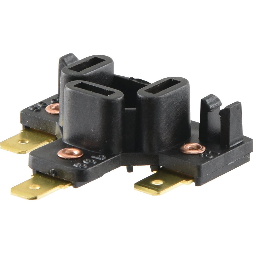 Close-up of a black plastic and metal electrical component with two pronged slots, four brass connectors, and marked as a 12/24V Head Light Bulb Adapter by Sparex (Part No. S.29754).