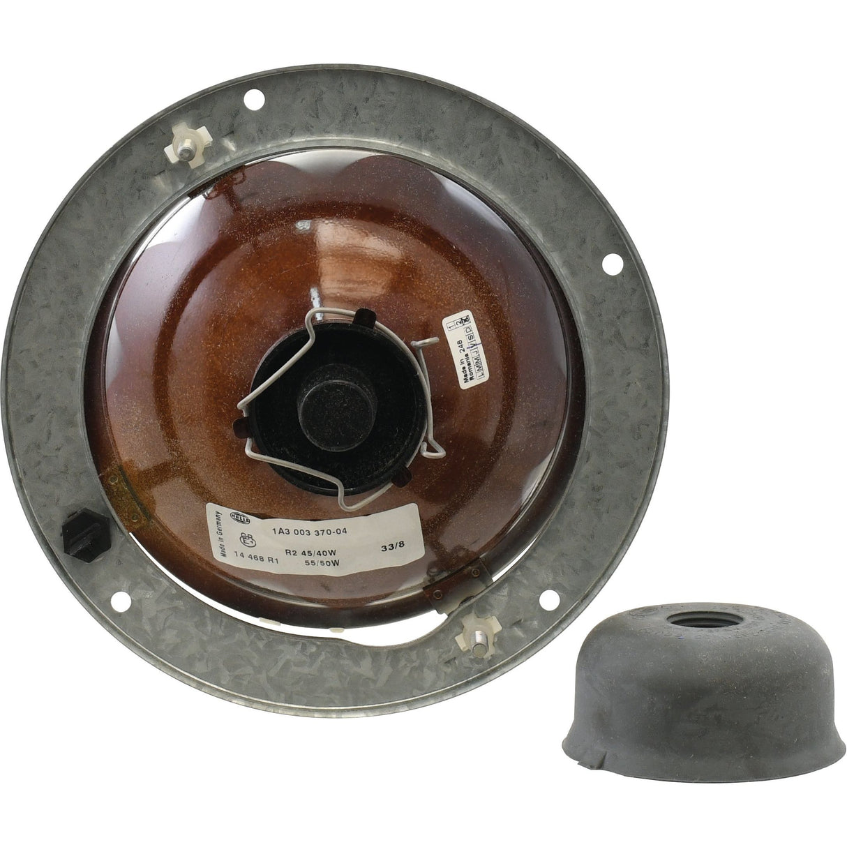 A round, metal Sparex Head Light housing (Halogen, RH & LH, RH Dip, 12V - S.75956) with a central socket is viewed from the back. A separately placed rubber cap is shown next to it, ready for panel mount installation of a halogen bulb.