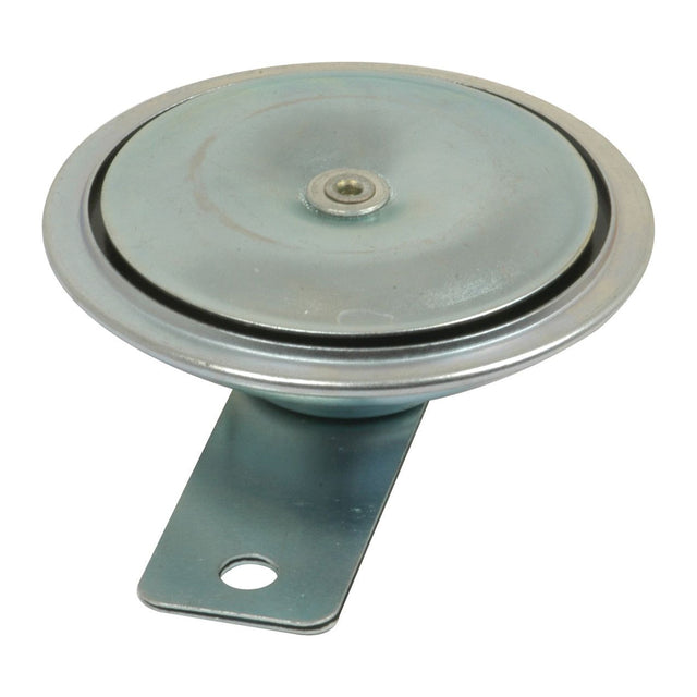 A round, metallic disk with a small, centered bolt and an attached mounting bracket with a hole; the Waterproof Horn 12V | Sparex Part No.S.4710 by Sparex is designed for durability and efficiency.