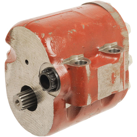 The Hydraulic Pump - S.64685 from Sparex is a red and silver unit featuring visible mounting holes and gear teeth. It has a weathered, metallic surface with areas showing wear, yet it remains efficient in handling various flow rates.