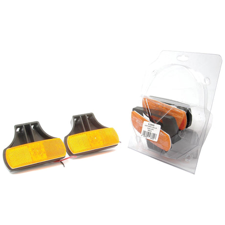 Two amber rectangular reflectors with black plastic housing, next to a packaged identical set in clear plastic, perfect as the Sparex LED Side Facing Marker Light (S.23624) with an amber lens for 12/24V.