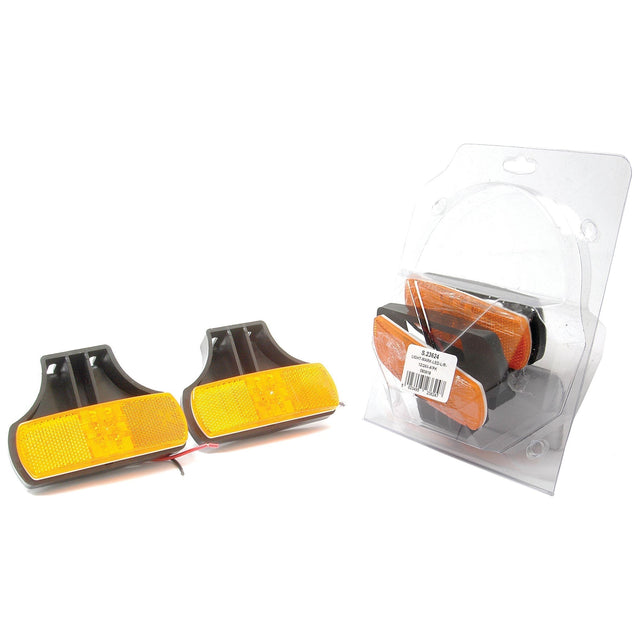 Two amber rectangular reflectors with black plastic housing, next to a packaged identical set in clear plastic, perfect as the Sparex LED Side Facing Marker Light (S.23624) with an amber lens for 12/24V.
