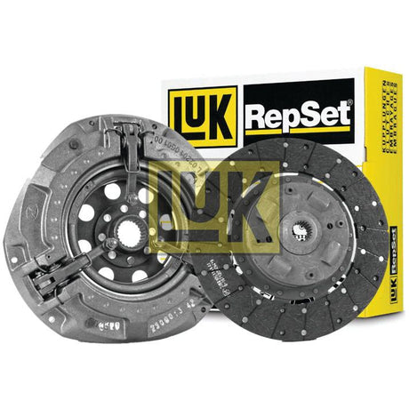 Image of an unopened Sparex Clutch Kit without Bearings - S.146833 box with two clutch system components made from organic material placed in front of it.
