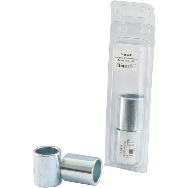 Two metal bushings, one standing upright and one lying on its side, are next to a packaged pair of identical Sparex Lower Link Conversion Bushes (Cat. 3 to 2) - S.56693 with a barcode and product label.