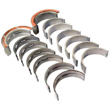 The Sparex Main Bearing +0.020'' (0.50mm) (Set), Part No. S.66533, includes a set of metal half-shell main bearings arranged in two rows, with one bearing featuring a rust-colored coating on its inner edge, suitable for use in Case IH and Ford / New Holland machinery.