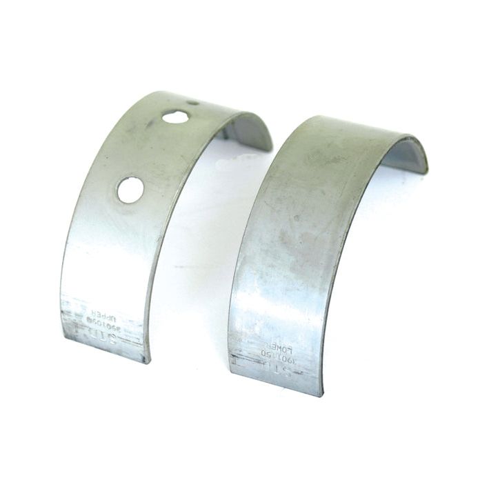 Two silver metal bearing shells, one with two holes and one without, are placed side by side on a white background—a perfect fit for Ford New Holland machinery. These bearings are known as the Sparex Main Bearing Std. (Pair), Part No.S.59558.
