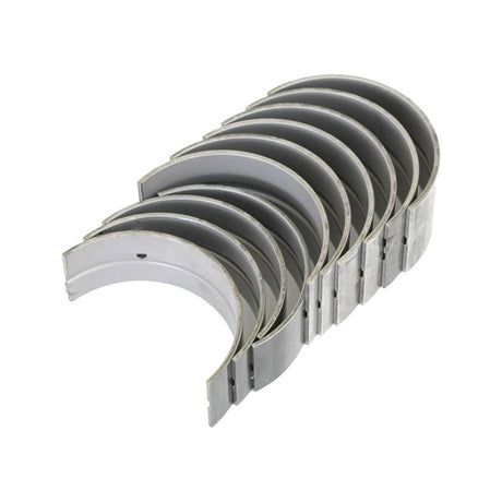 A set of Sparex Main Bearings Std. (Part No. S.62050), arranged in a staggered pattern, ideal for White Oliver tractors, featuring several semi-circular metal engine bearings.