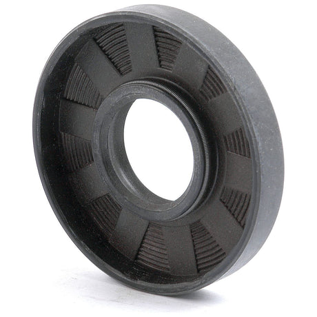 Close-up of the Sparex Metric Rotary Shaft Seal, 26 x 62 x 10mm Double Lip (Sparex Part No.S.50218), featuring a black mechanical seal with a grooved inner surface and a ridged outer edge, used for containing fluid in a machine. This high-performance seal ensures optimal performance.