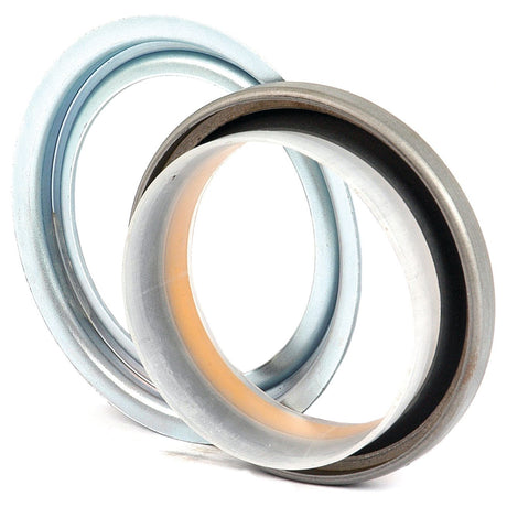 Two metallic circular mechanical seals from Sparex, with varying layers and textures, positioned at slight angles to each other against a plain white background, resembling components you'd find in a Case IH Harvester. These seals are specifically the Metric Rotary Shaft Seal, 62 x 79.75 x 10mm (Sparex Part No.S.59506).