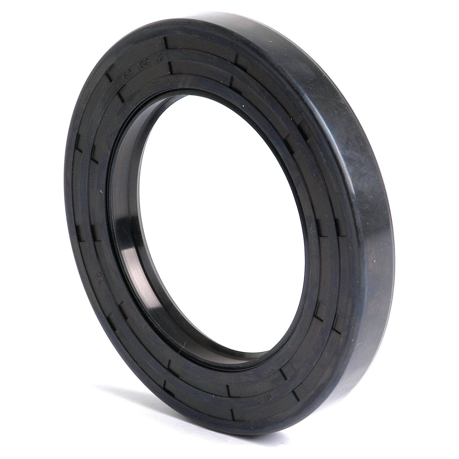 A close-up of the Sparex Metric Rotary Shaft Seal, 65 x 100 x 12mm Double Lip (Sparex Part No. S.50440) reveals its black rubber construction with a circular shape and ridged edges, commonly used in machinery to prevent lubricant leakage. This seal features a Double Lip design for enhanced efficiency.