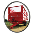 A red agricultural trailer, displaying the "Ktwo Roade" logo on the rear, is parked on a grassy field. Seen through a Sparex Mirror Head - Round, Ø125mm (Flat), it creates a picturesque view. In close proximity, a Centre Clamp Fixing from Sparex adds functional detail to this practical scene.