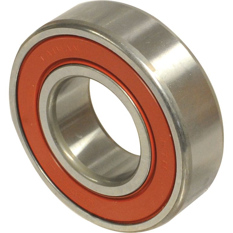 Close-up of the Sparex NTN SNR Deep Groove Ball Bearing (63072RS) | Sparex Part No. S.129667 featuring an orange seal. The bearing, crafted by NTN SNR, is cylindrical with an inner ring, an outer ring, and visible races.
